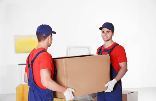 Team member preparing a safe move with equipment and protective care