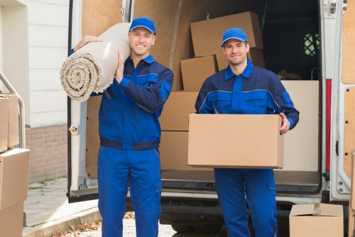 Careful manual handling of a moving box during transport work