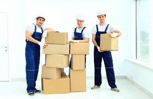 Local movers handling furniture in a residential street near Snaresbrook